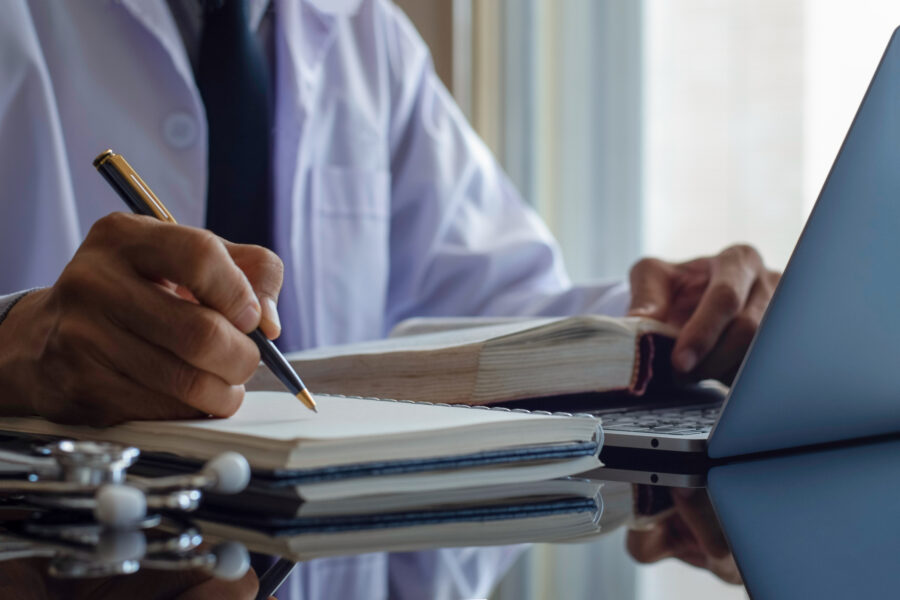 A male doctor reading a report