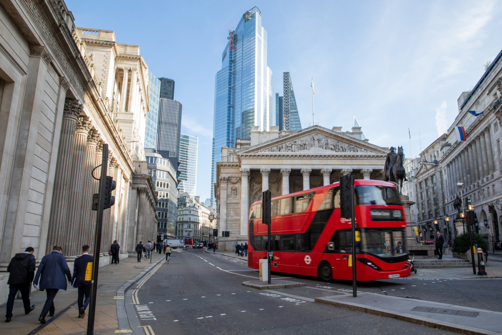 London road with red bus and Gherkin in background