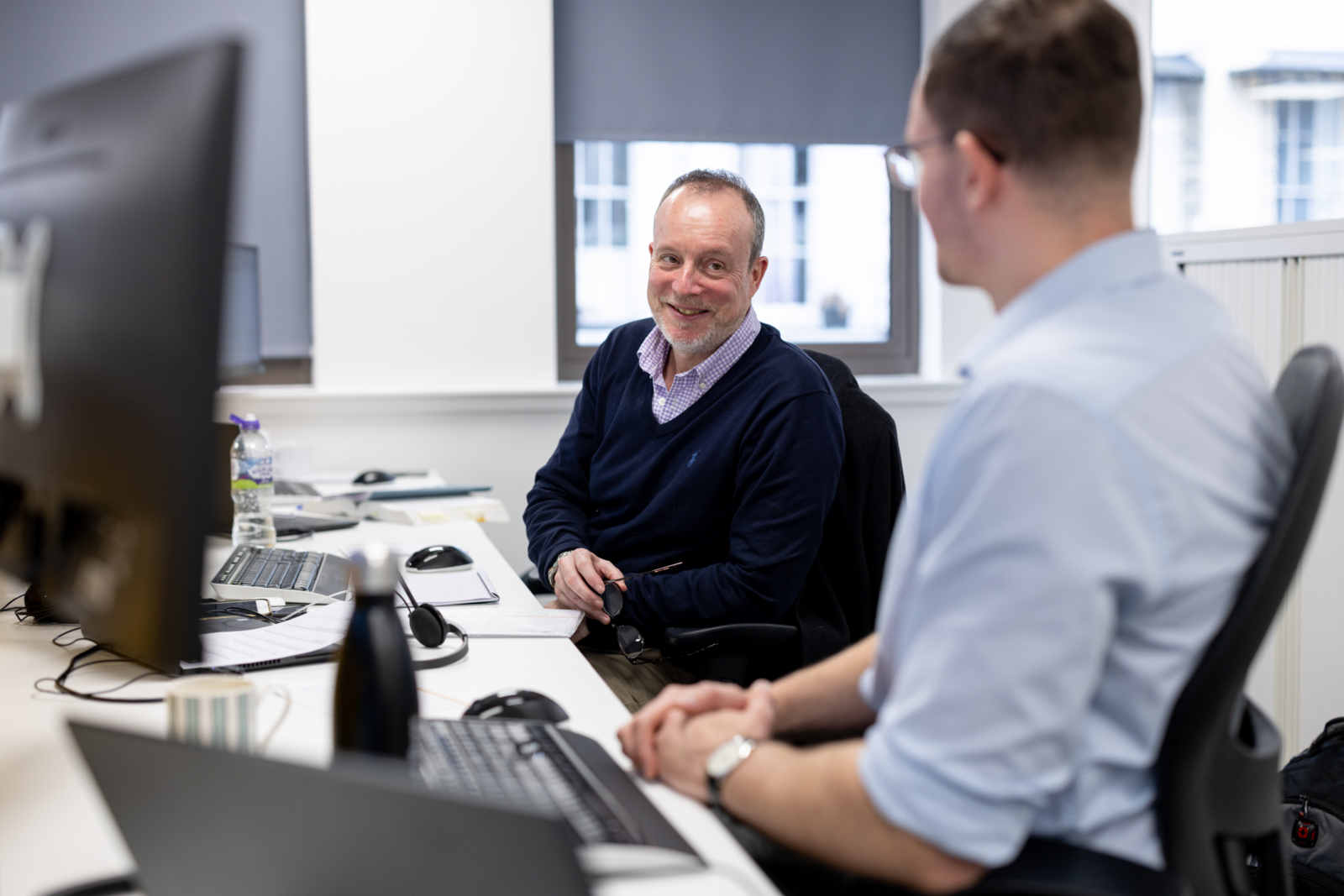 A Restructuring and Insolvency Partner talking to a colleague