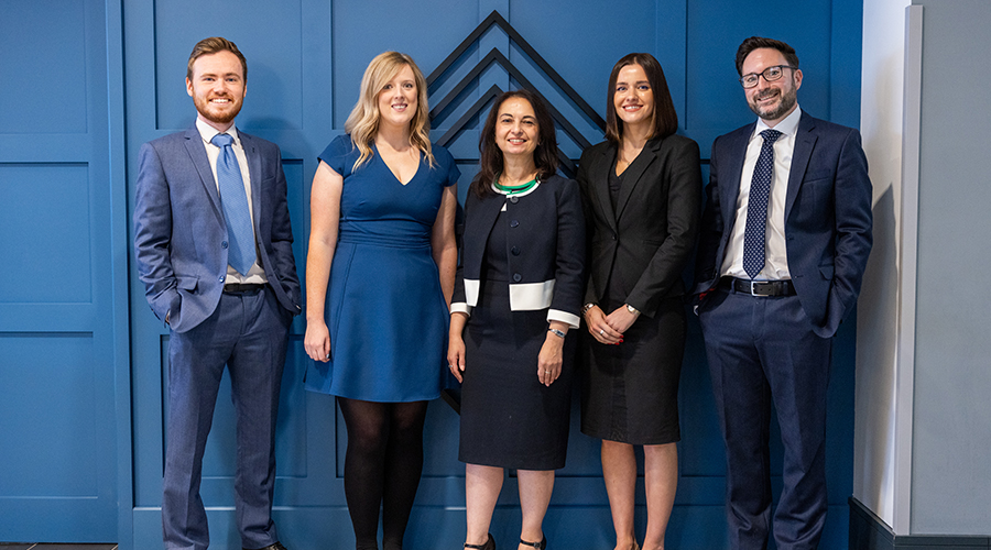 Corporate lawyers standing in a group