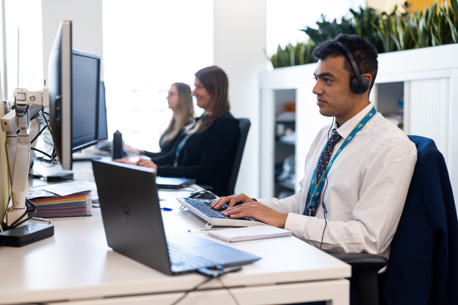 man working at a computer in office