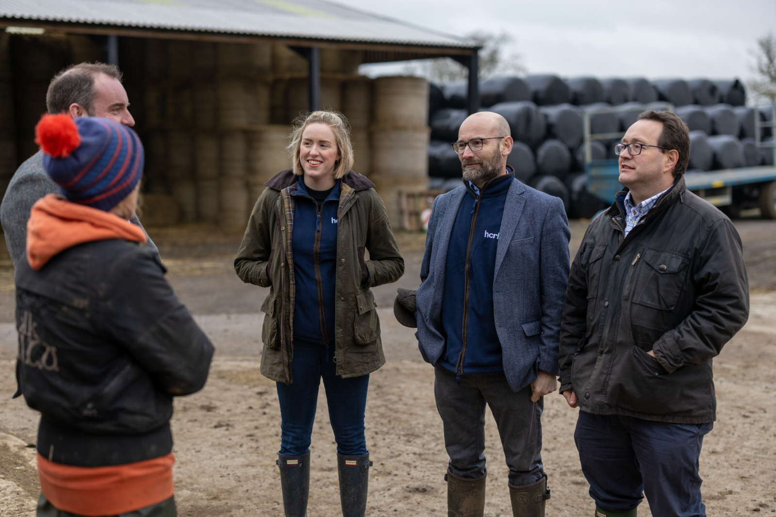 HCR Agriculture and Estates team talking on a farm with a client