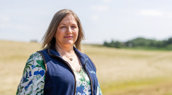 A photo of Sarah Harbord on a farm