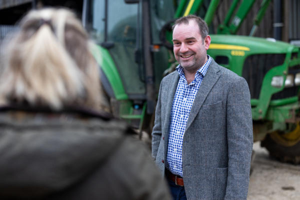 One of our agriculture team talking to a client on their land