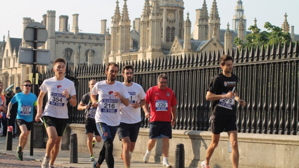 Runners for Chariots passing King's College