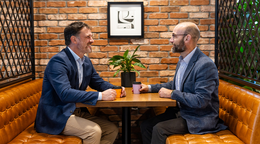 Lawyer and client chatting in a cafe