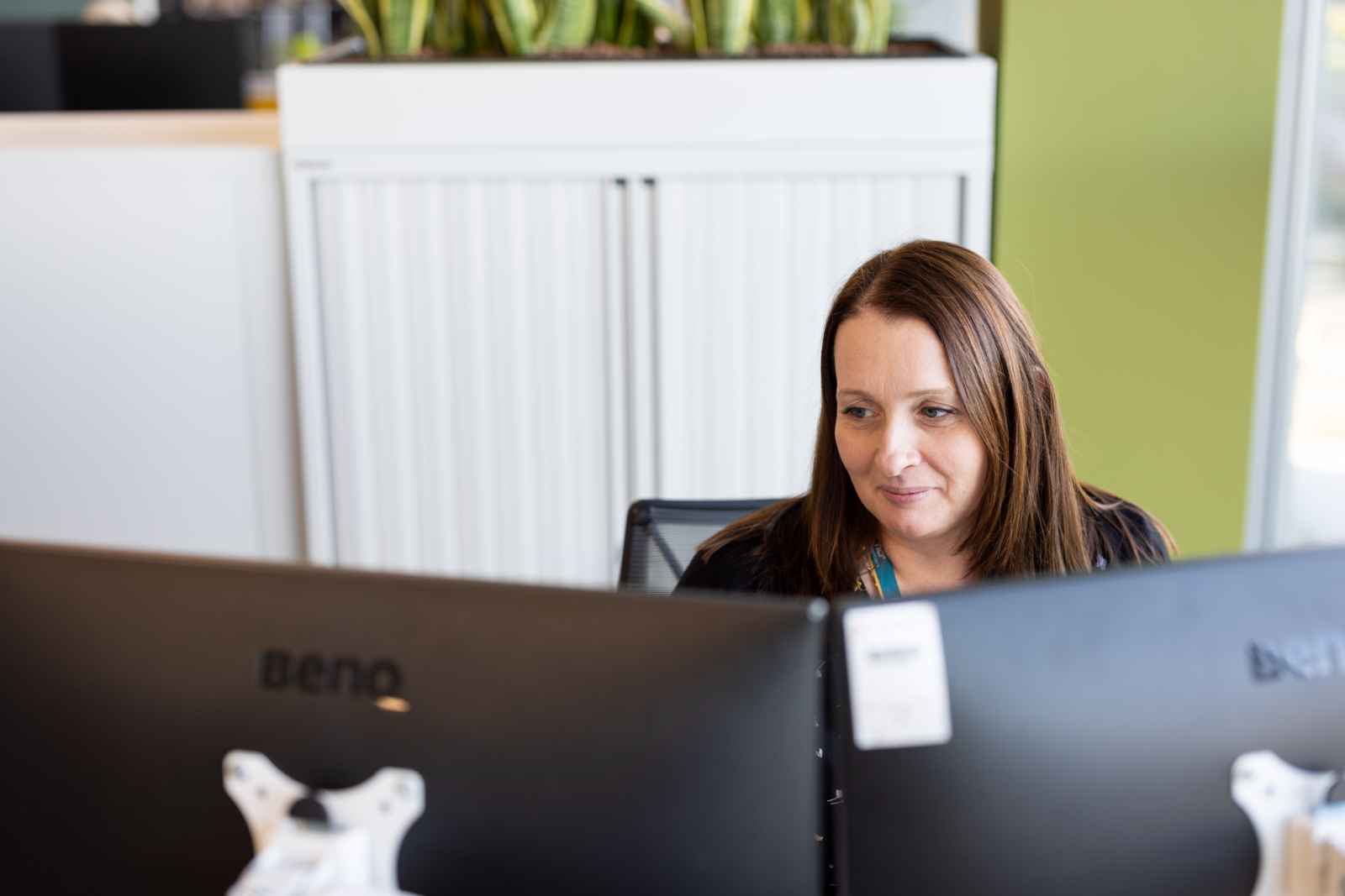 Woman looking at a computer