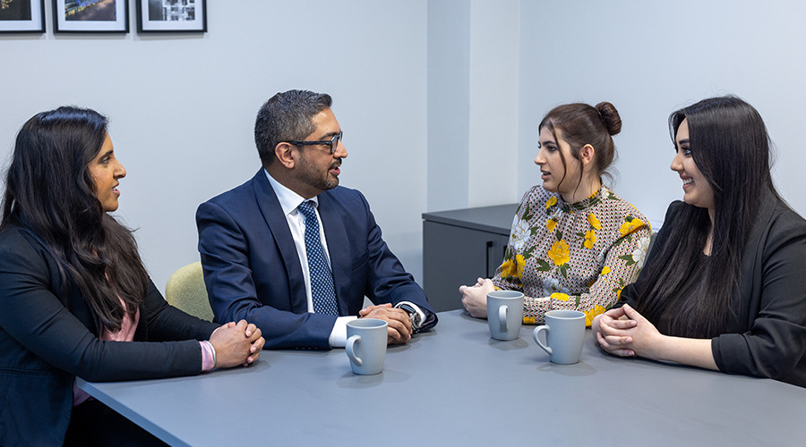 Dispute resolution lawyers having a meeting