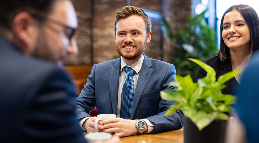 Photo of solicitors discussing an item