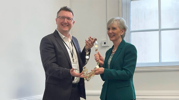 image of steven murray holding a chain of office