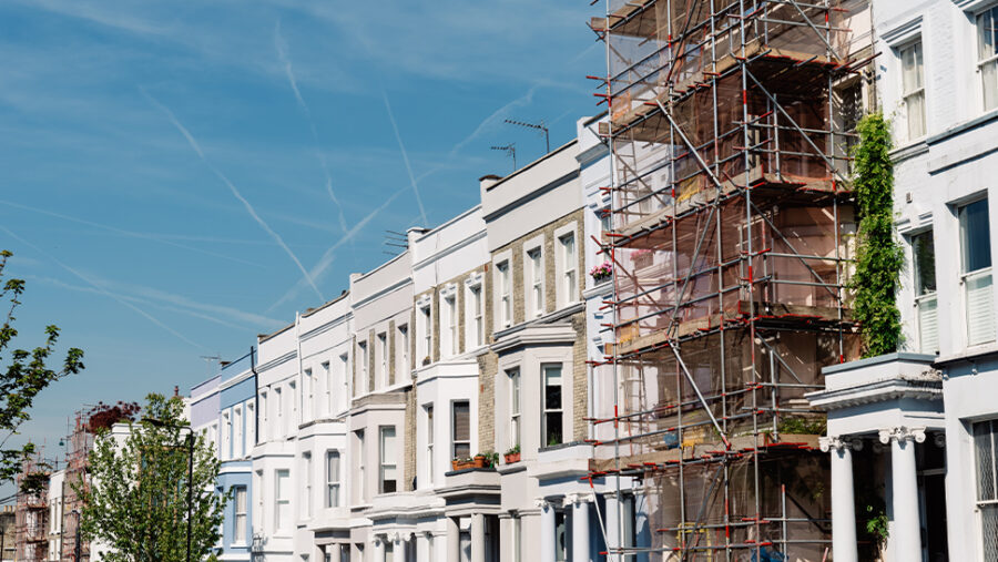 Image of a row of houses one of the houses has scaffolding