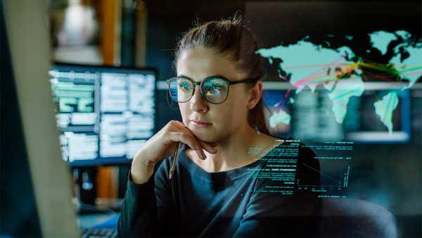 Image of woman at a computer conducting an international data transfer