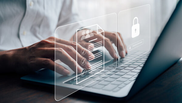Photo of someone typing on a keyboard