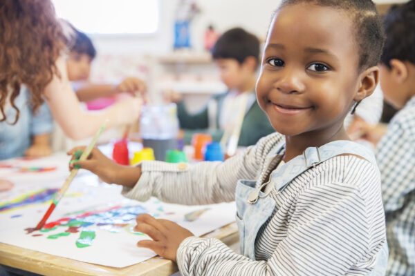 A photo of an infant at an early years school