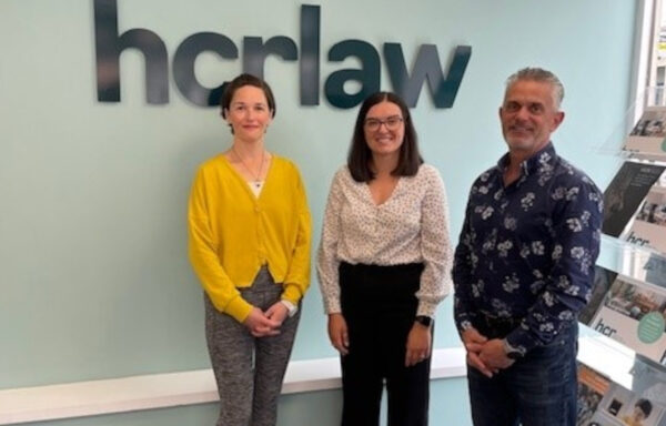 Solicitors with a charity representative
