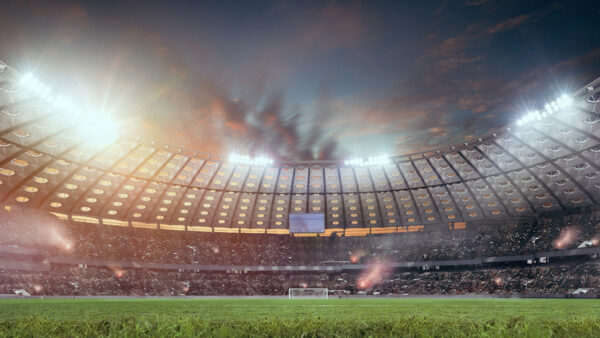 Football arena with lights on