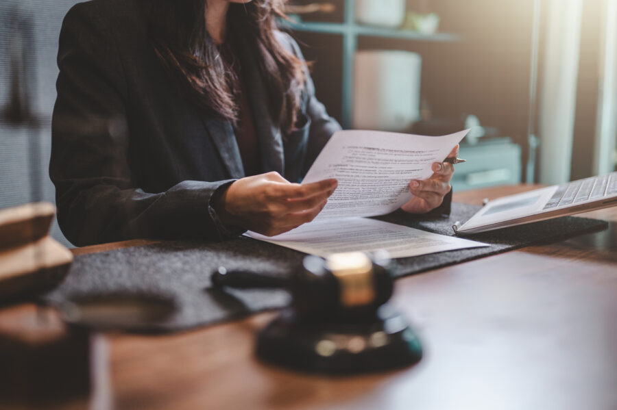 A female prosecutor reviewing documents