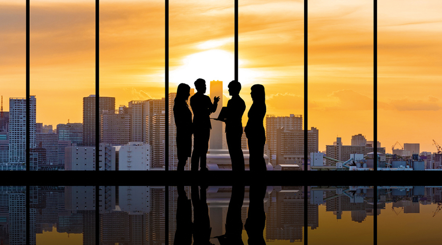 Business people at a sunset