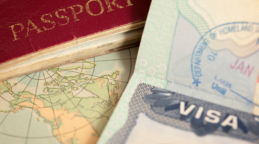 A picture of a passport and map