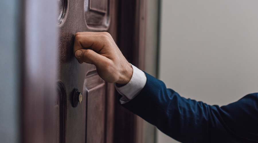 A person knocking on a door