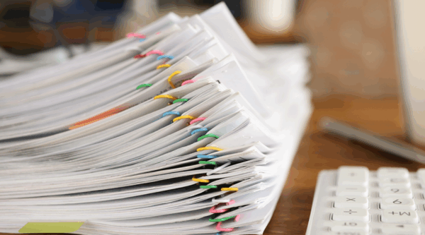 A paper bundle of CQC complaint documentation
