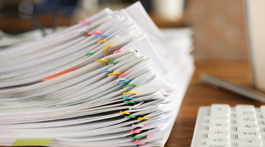 A paper bundle of CQC complaint documentation