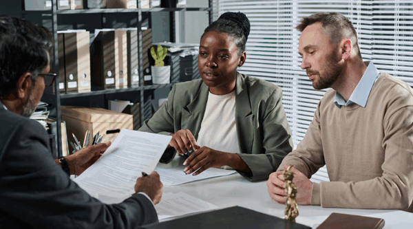 A couple having a meeting with a lawyer