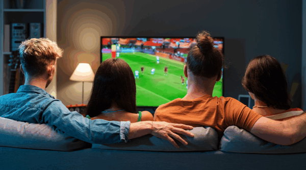 A family watching sport on tv