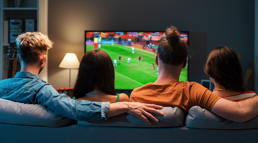 A family watching sport on tv