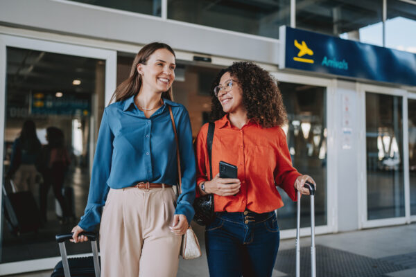 Image of two people arriving in the UK