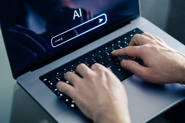 A person typing into a generative AI tool