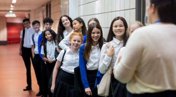A picture of school kids queuing