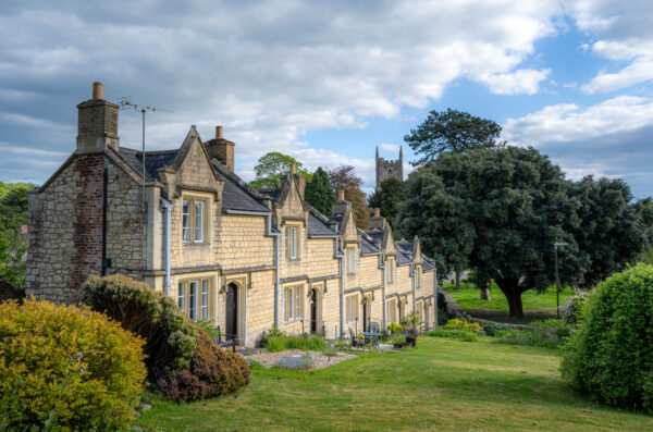 A photo of a row of historic almshouses