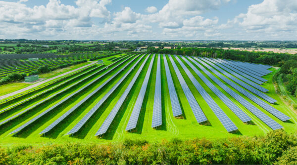An aerial view of a solar farm on a field