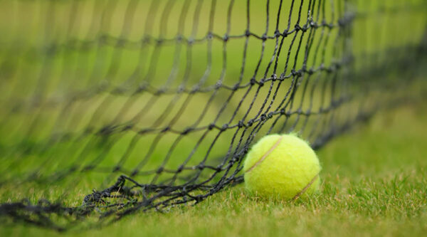 A tennis ball on a pitch