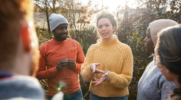 Charity personnel discussing something while outside