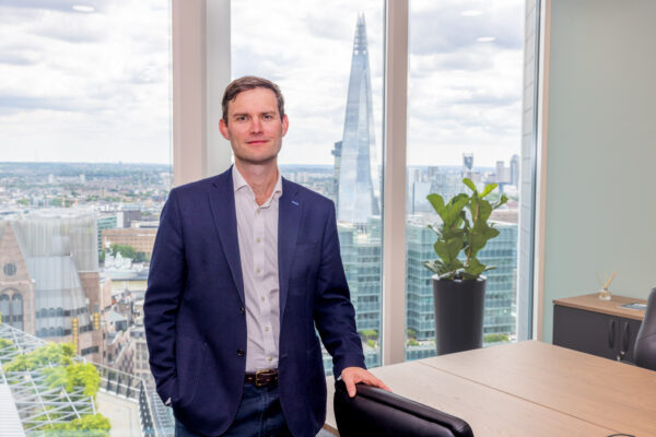 Harry Bengough standing in our new London Office