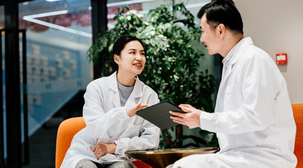 Two people discussing visa requirements