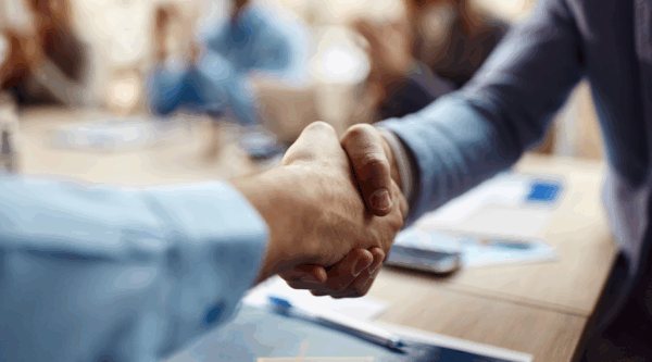 Two people shaking hands in partnership