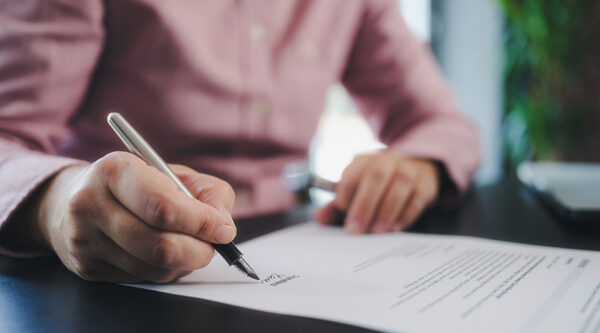 Person signing an official document