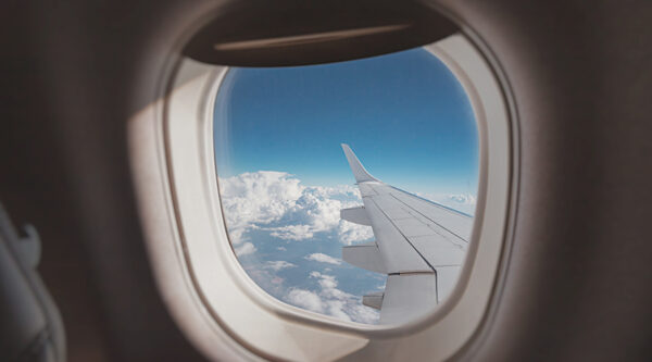 A picture of a porthole in a jet liner