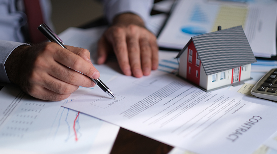 A picture of a man filling out a property registration form