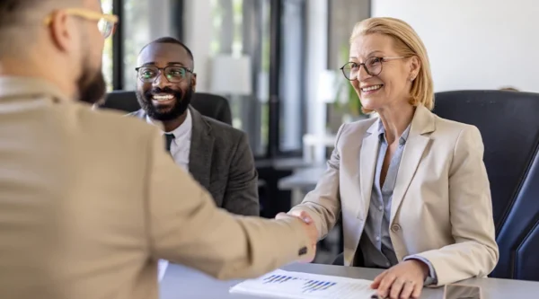 Two business people shaking hands