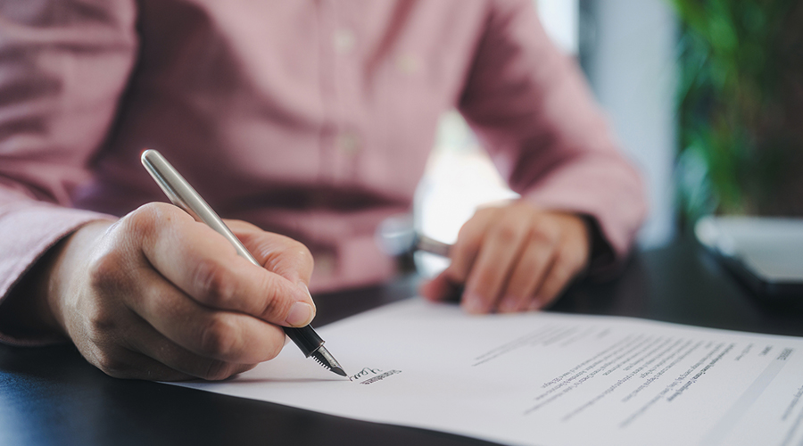 A person signing a contract