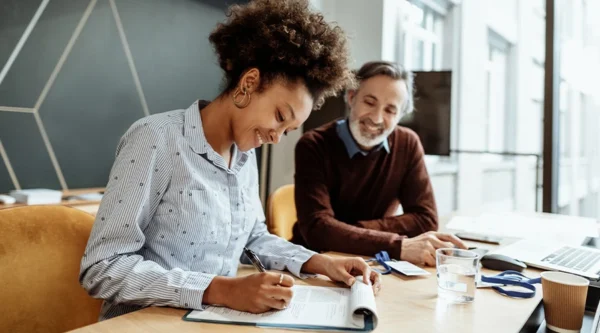 Two business people checking a contract