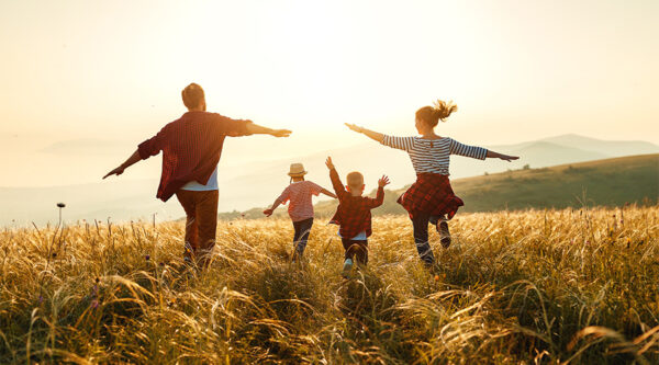A family in a field enjoying life