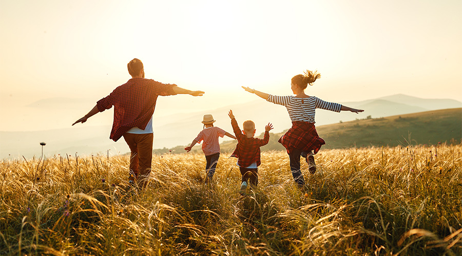 A family in a field enjoying life