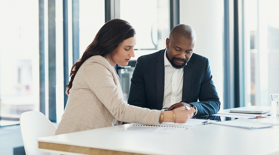 Lawyer and client looking over legal documents