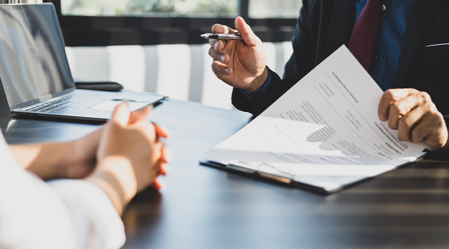 Client and lawyer signing papers