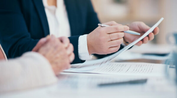 Person checking a document for their liability